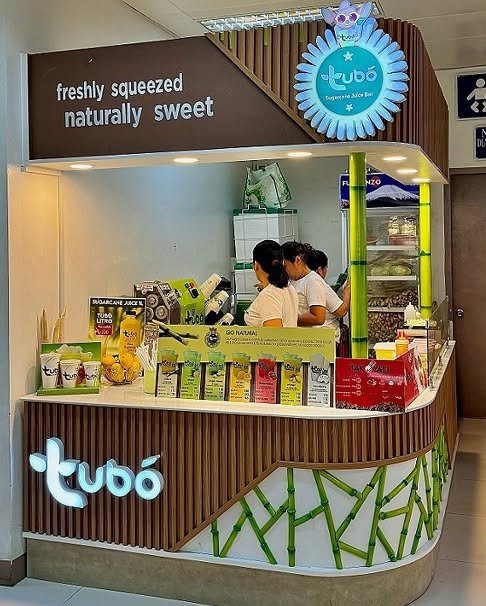 Tubó kiosk front with bamboo graphic and logo sign